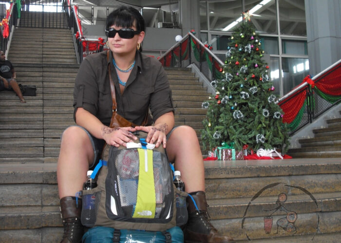 Sylwia waiting at African airport with a backpack – the start of a real journey
